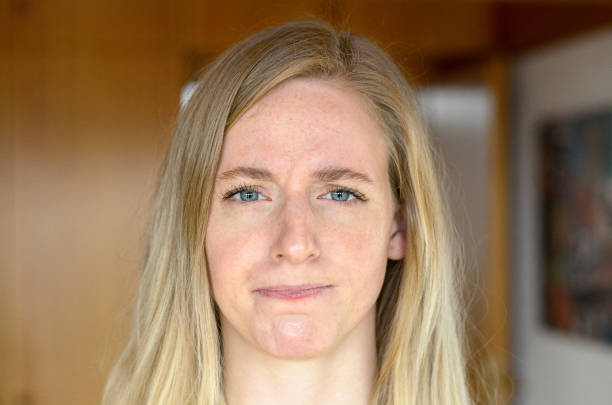 istock Woman with long blond hair looking ahead 647725480