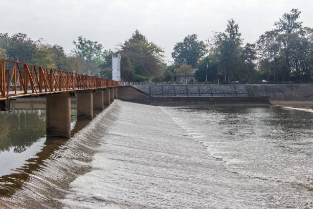 istock Water flowing from the dam, Water for Irrigation countryside. Background 647736782