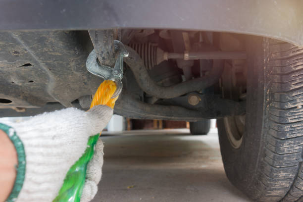 istock Hand holding tow rope near towing hook assembled to a broken car 647742276
