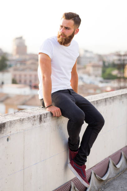 istock Bearded man posing in the street. 647742542