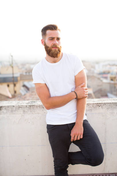 istock Bearded man posing in the street. 647742922