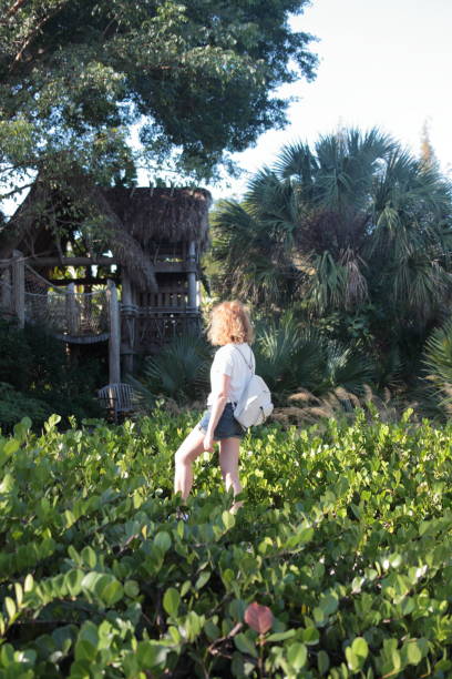 istock Woman in a tropical garden. 647742930