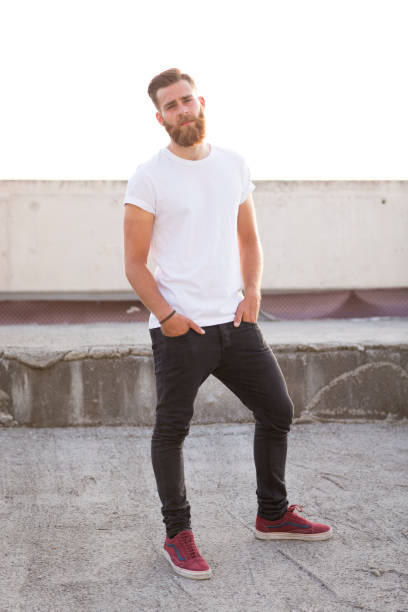 istock Bearded man posing in the street. 647743394