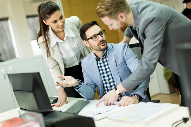istock Group ofyoung business people at office 647746614