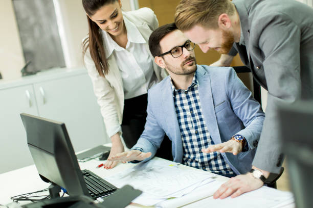 istock Group ofyoung business people at office 647746634