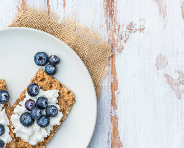 istock Wholegrain Rye Crispbread Crackers with Blueberries 647749576