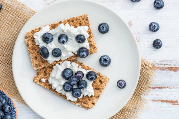 istock Wholegrain Rye Crispbread Crackers with Blueberries 647749832