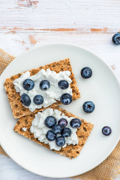 istock Wholegrain Rye Crispbread Crackers with Blueberries 647749888