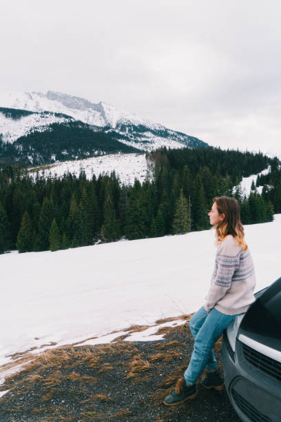 istock Woman in the mountains in winter 647753882