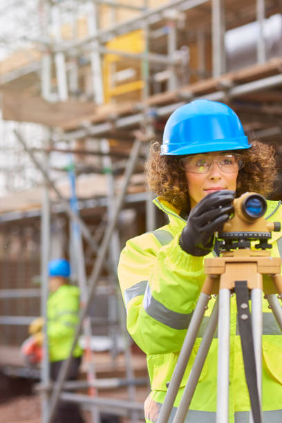 istock female surveyor on housing development 647763064