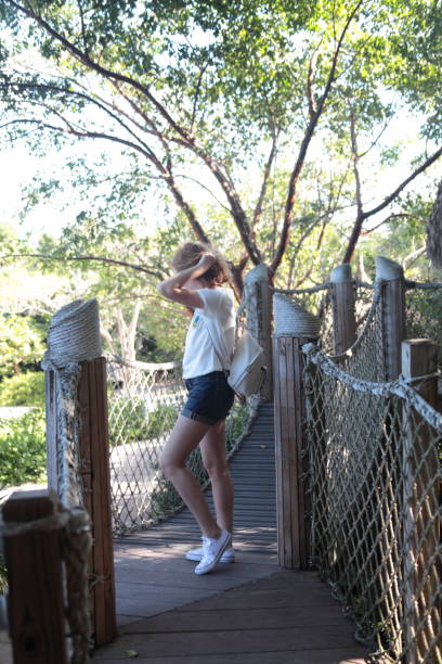 istock Woman on a bridge. 647763412