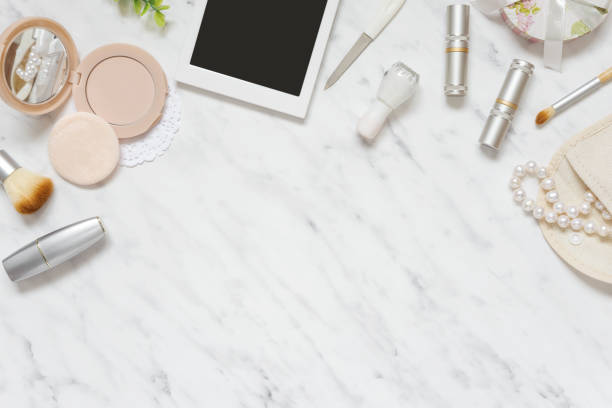 istock Woman's workplace with cosmetic and smartphone 647766302