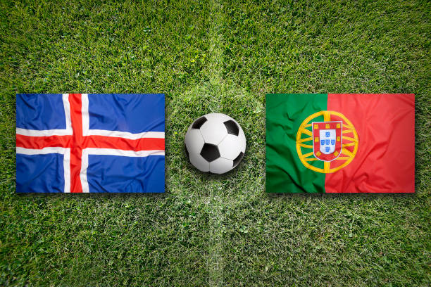 istock Iceland vs. Portugal flags on soccer field 647772596