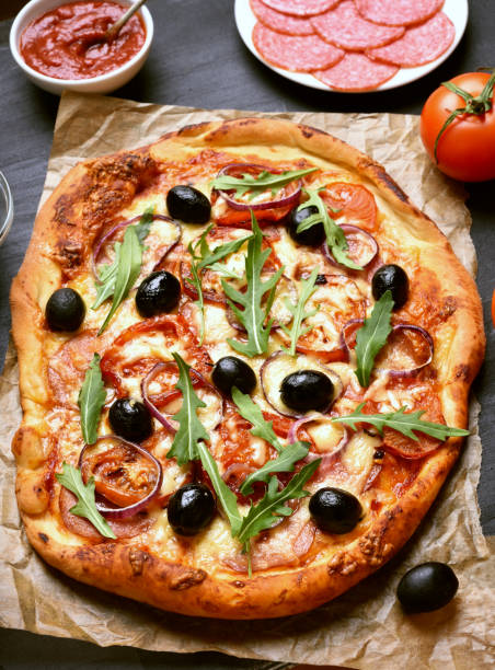 istock Pizza with salami and tomatoes 647776594