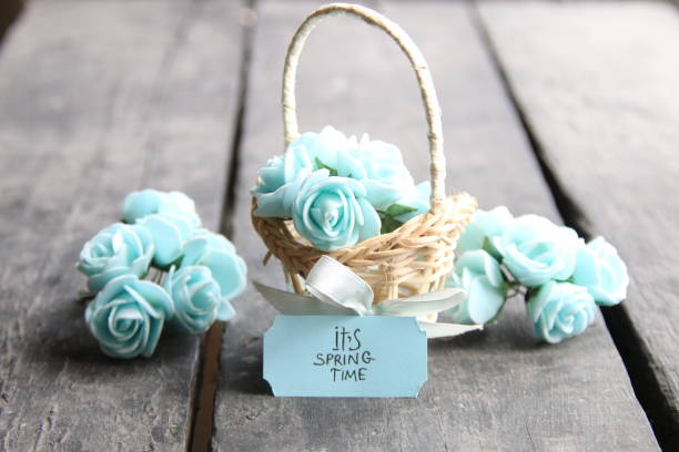 istock Its spring Time, spring flowers in a small basket on a vintage background 647777758