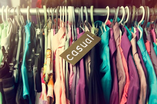 istock Clothes hanging on the rack in the store 647783000
