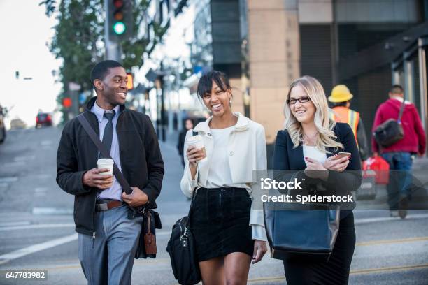 Three Multi Ethnic Millennials In Business Attire With Coffee In Downtown Los Angeles Stock Photo - Download Image Now