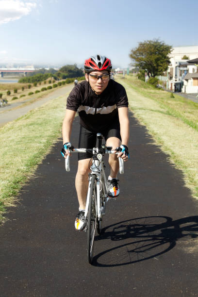 istock Japanese men cycling 647787076