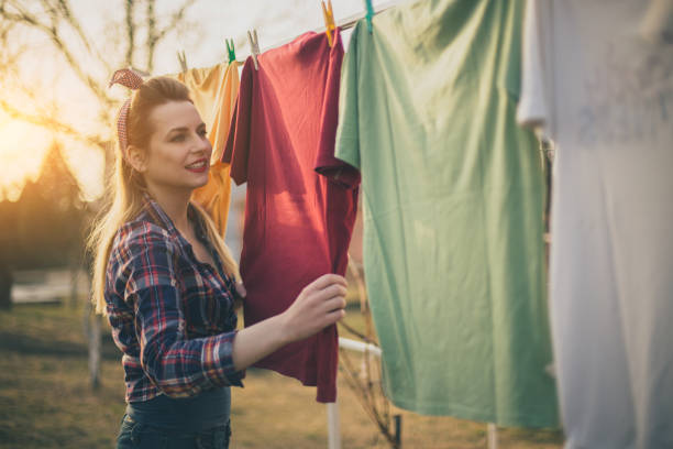 istock Beautiful vintage girl doing laundry 647788060