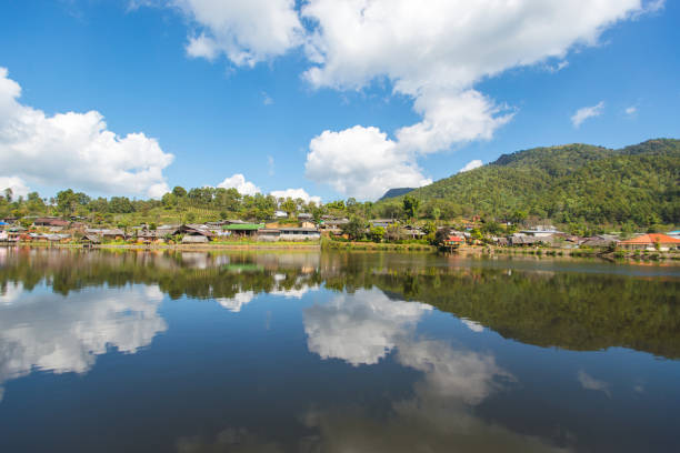 istock Reflection of Thai house with blue sky 647801488
