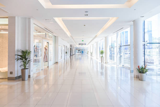 Empty shopping mall Background of empty corridor in modern shopping mall shopping mall stock pictures, royalty-free photos & images