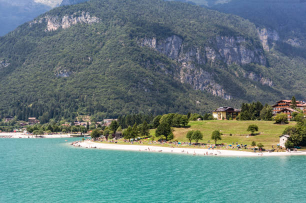 istock Beach on lake Molveno in Italy 647806296