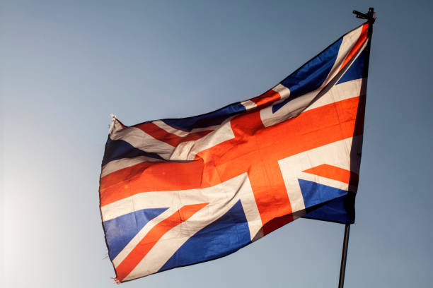 istock Union jack flying in the sky 647817182