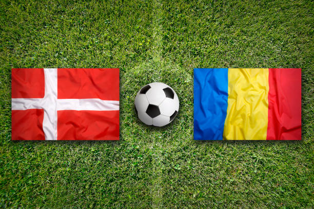 istock Denmark vs. Romania flags on soccer field 647823990