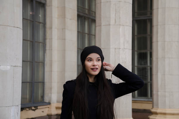 istock beautiful girl near columns 647827596