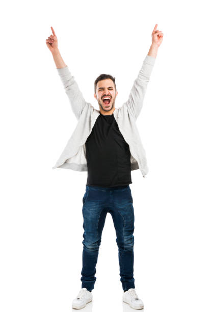 Happy man Successful young latin man with arms up arms raised stock pictures, royalty-free photos & images