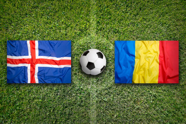 istock Iceland vs. Romania flags on soccer field 647834204
