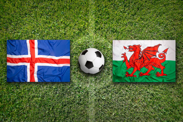 istock Iceland vs. Wales flags on soccer field 647839658