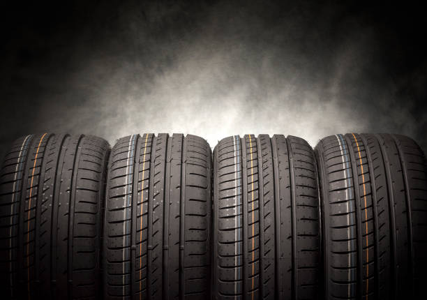 istock Car tires on a dark background. 647839784