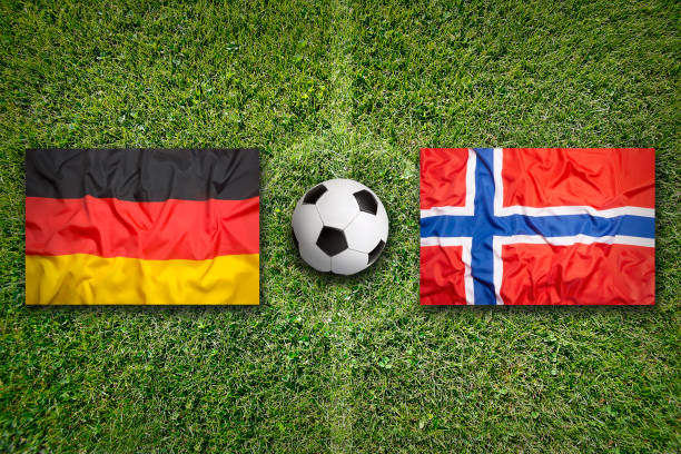 istock Germany vs. Norway flags on soccer field 647839816