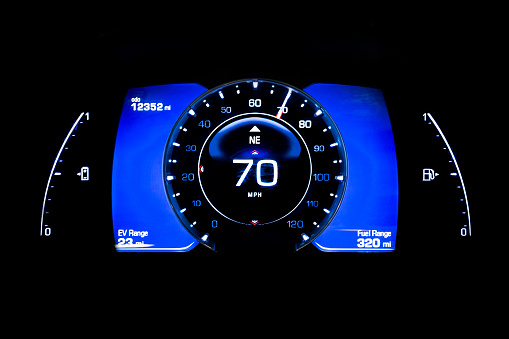 Modern light car mileage (dashboard, milage) isolated on a black background. Mileage of a electric car with batteries. New display of a modern car. 70 mph.