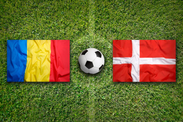 istock Romania vs. Denmark flags on soccer field 647845554