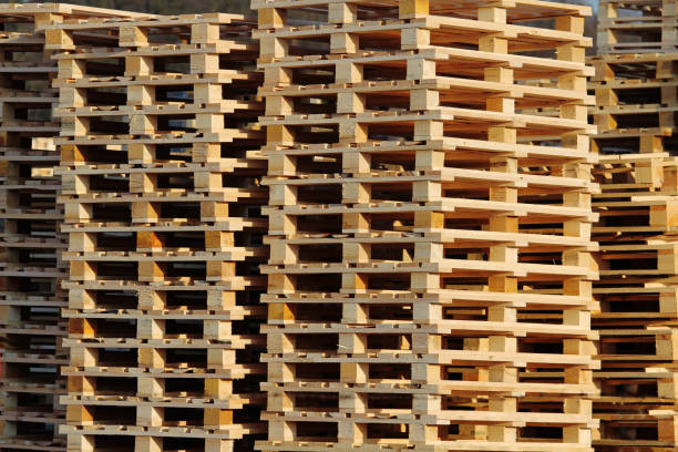 wooden euro pallets on warehouse backyard stock photo