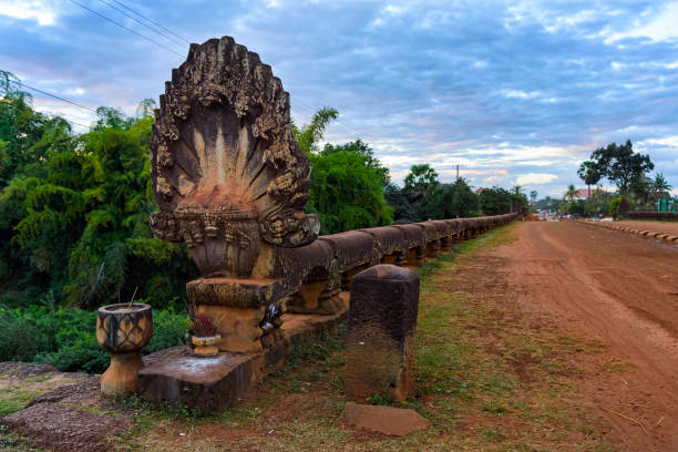 istock Naga statue on historic Preah Tis Bridge, Cambodia. 647845954