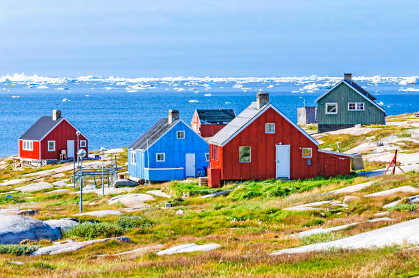 The colorful houses of Rodebay, Greenland This settlement is located on a small peninsula jutting off the mainland into eastern Disko Bay, 22.5 km north of Ilulissat. It had 46 inhabitants in 2010 greenland stock pictures, royalty-free photos & images