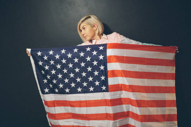 istock Blonde girl with USA flag 647848936