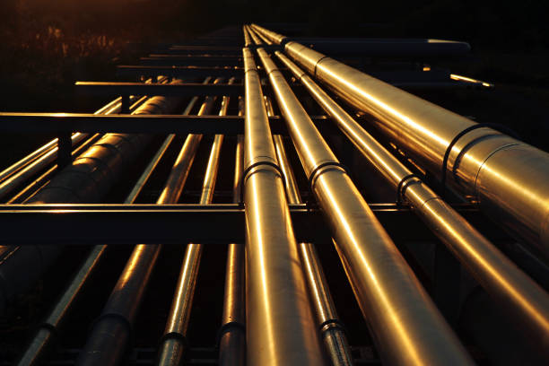 golden pipeline system transport in oil crude refinery golden pipeline system transport in oil crude refinery refinery photos stock pictures, royalty-free photos & images