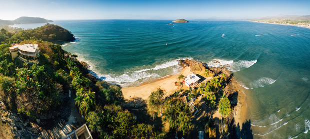 Vibrant sunrise over the wild untamed coastal beauty of Manuel Antonio National Park on the Pacific Coast of Costa Rica.