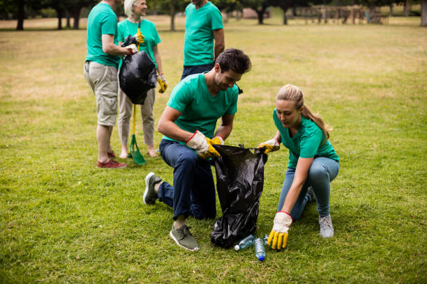 istock Team of volunteers picking up litter 647855566