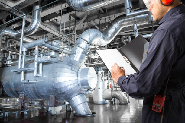 istock Engineer taking notes at thermal power plant factory 647858680
