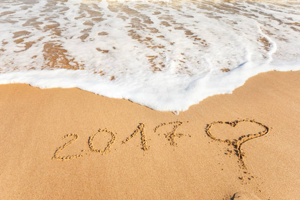 istock New Year 2017 on the ocean beach 647858880