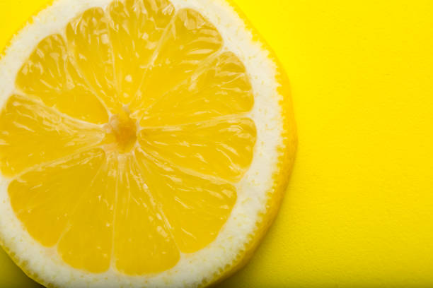 istock Cross section of lemon on white background 647861584