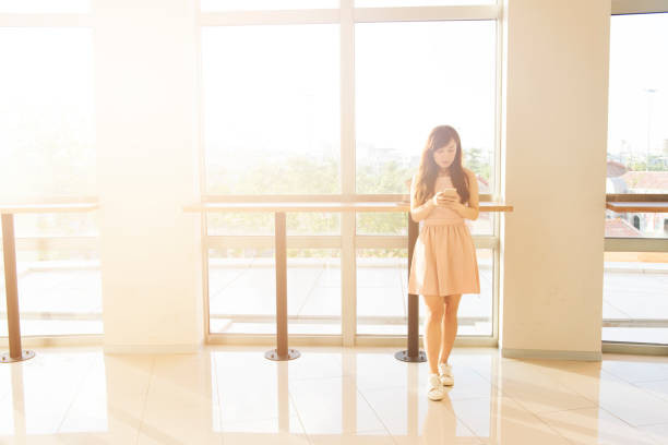 istock Woman sending message with smartphone 647861772