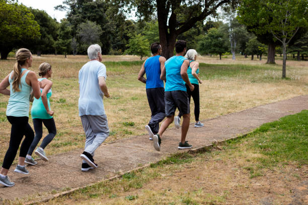 istock Athletes running race in park 647865478