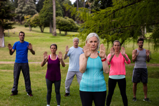istock Group of people exercising together 647871144