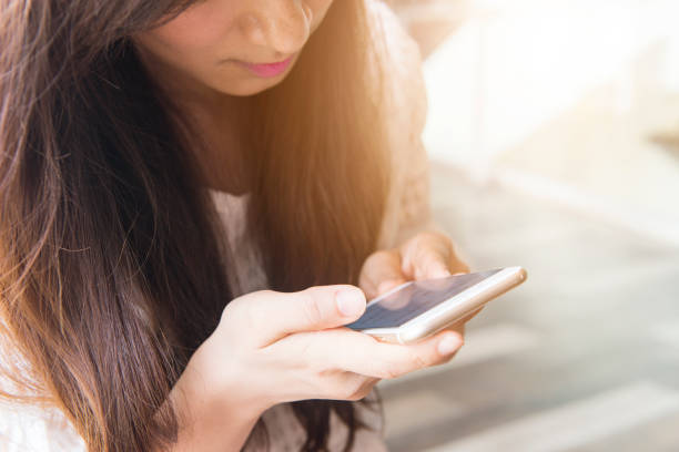 istock Woman sending message with smartphone 647871760